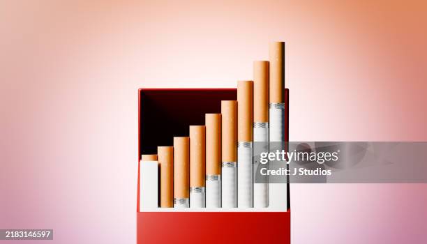 growing graph made of cigarettes - sigaretta foto e immagini stock