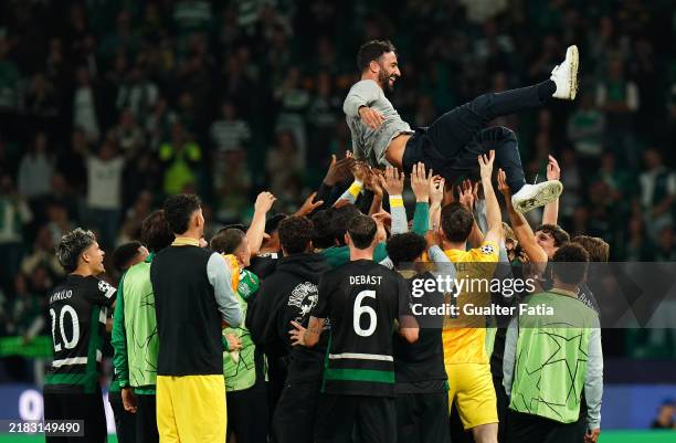 Ruben Amorim, Head Coach of Sporting CP, is thrown into the air by his players to celebrate his last home match as manager at the end of the UEFA...