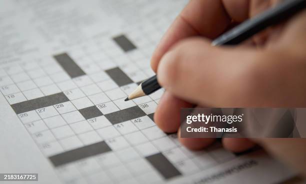 close-up on an empty crossword puzzle - rompicapo foto e immagini stock