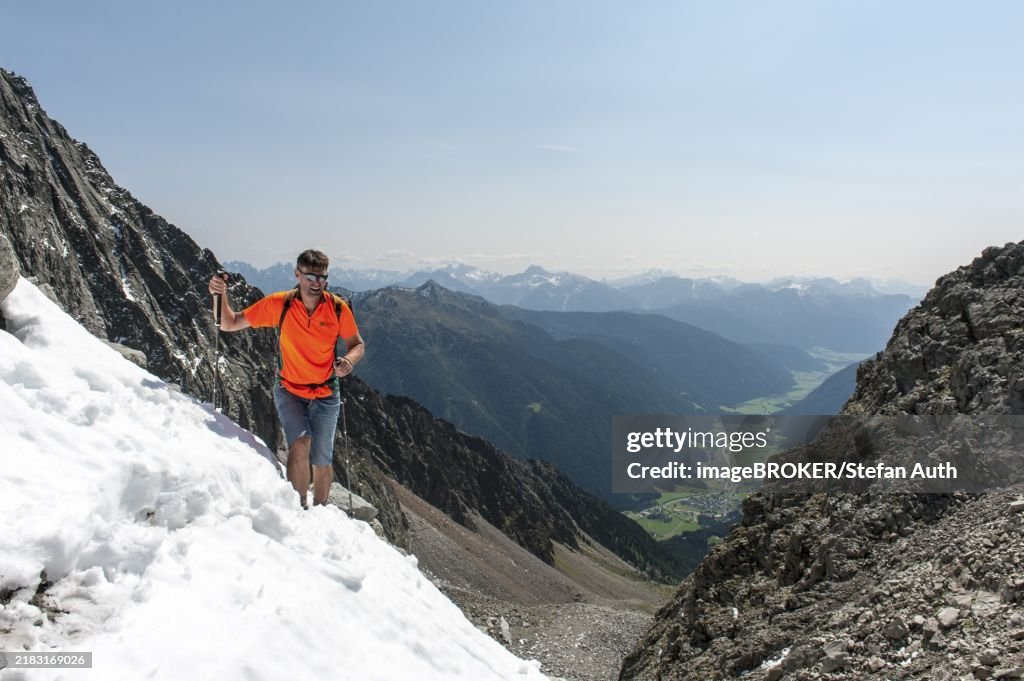 Mountaineering, mountaineer climbs up through snow in a saddle, Antholzer Scharte, Antholzer Tal, Rieserfernergruppe, Rieserferner-Ahrn nature park Park, Rasen-Antholz, Rasun-Anterselva, South Tyrol, Alto Adige, Italy, Europe