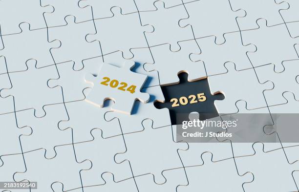 stepping into the future: a puzzle piece uncovers 2025 beneath 2024 - new years day stock pictures, royalty-free photos & images