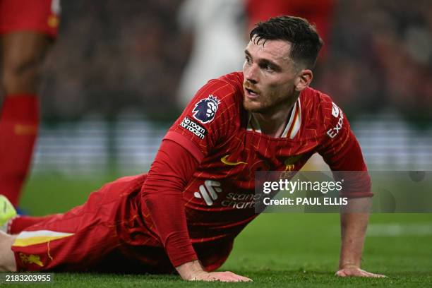 Liverpool's Scottish defender Andrew Robertson picks himself up during the English Premier League football match between Liverpool and Aston Villa at...
