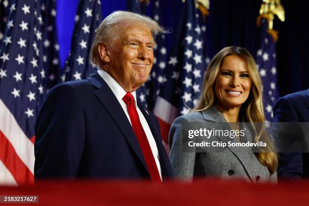 Republican presidential nominee, former U.S. President Donald Trump and former first lady Melania Trump look on during an election night event at the...