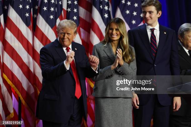 Republican presidential nominee, former U.S. President Donald Trump dances on stage with former first lady Melania Trump and Barron Trump during an...