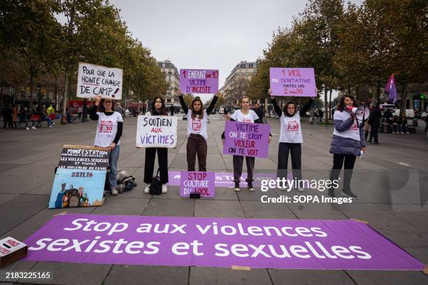 Protesters from the feminist association #NousToutes hold placards denouncing sexual violence and rape culture and showing support for all victims,...