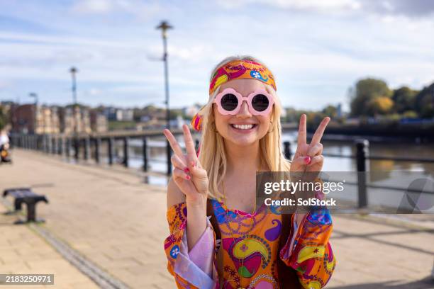 smiling woman in colourful hippie costume - hippy stock pictures, royalty-free photos & images