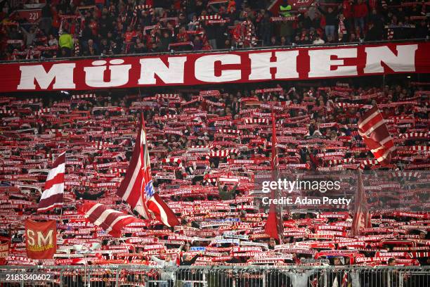 Fans of Bayern Munich hold scarves and fly flags in support prior to the UEFA Champions League 2024/25 League Phase MD4 match between FC Bayern...