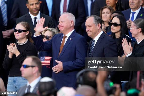 Hope Walz, Democratic vice presidential nominee, Minnesota Gov. Tim Walz, Second gentleman Doug Emhoff and Ella Emhoff react as Democratic...
