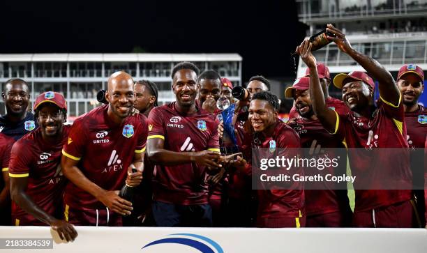 West Indies celebrate with the series trophy after winning the 3rd One Day International between the West Indies and England at Kensington Oval on...