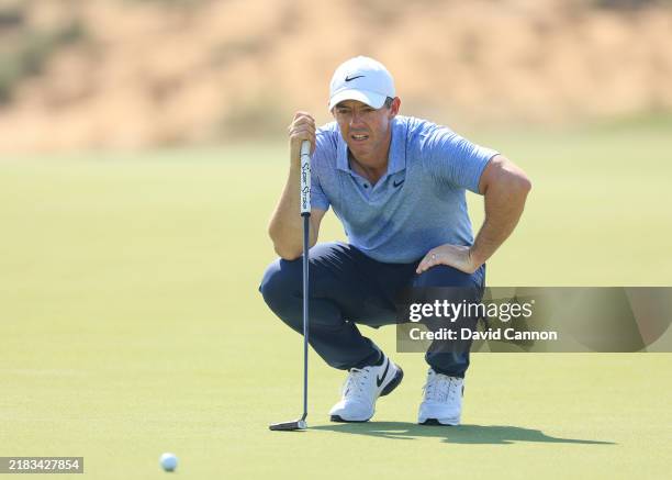 Rory McIlroy of Northern Ireland lines up a putt on the sixth hole during the first round of the Abu Dhabi HSBC Championship 2024 at Yas Links Golf...