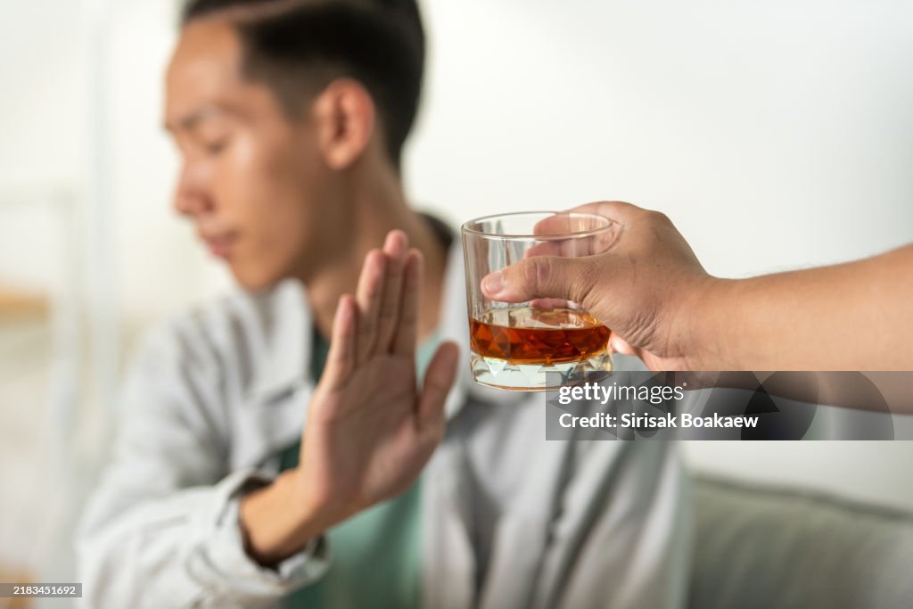 Young Man Rejecting Alcohol: Choosing a Healthy Lifestyle