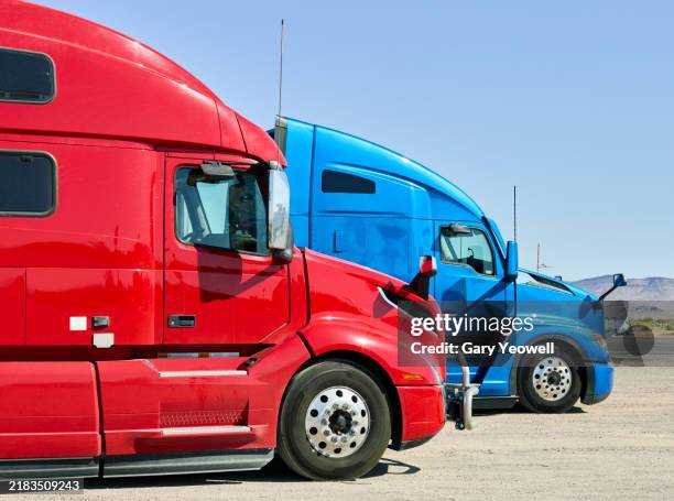 two trucks parked - trucking stock pictures, royalty-free photos & images