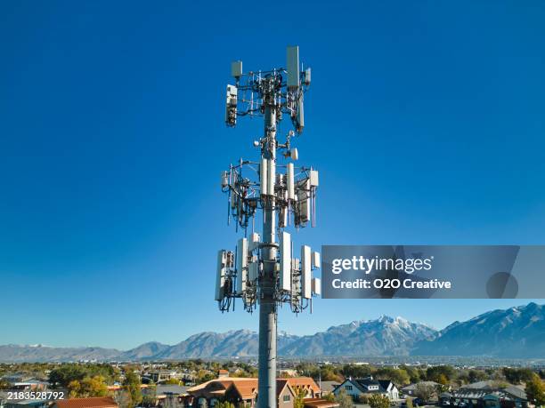 comminication tower against a blue sky - radiomast bildbanksfoton och bilder