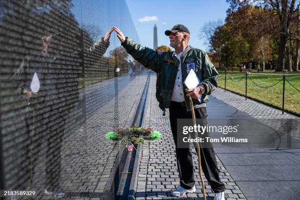 Vietnam War Army veteran Harry Metzler of Lexington Park, Md., pays respects to men he served with in the 1st Infantry Division at the Vietnam...