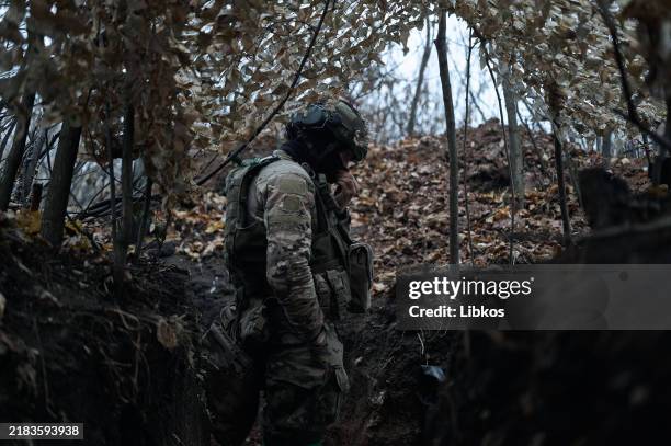 Ukrainian soldiers from the mortar group of the "Karpatska Sich" battalion carry out combat operations and target Russian military with a 120 mm...