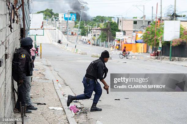 Haitian police officers deploy in Port-au-Prince as they exchange gunfire with alleged gang members on November 11, 2024. Alix Didier Fils-Aime was...