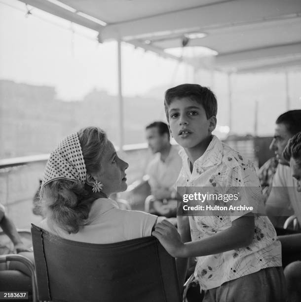 Alexander Onassis son of the Greek shipping tycoon Aristotle, with his mother Athina Livanos Onassis , on board the family's luxury yacht 'Christina'...