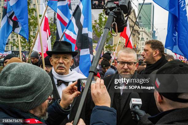 Controversial far-right member of the European Parliament Grzegorz Braun is interviewed alongside far-right politician and former member of the...