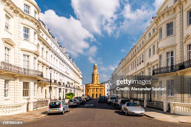 st. peter's church and residential townhouses in notting hill on a sunny day, london, england, uk - notting hill photos et images de collection
