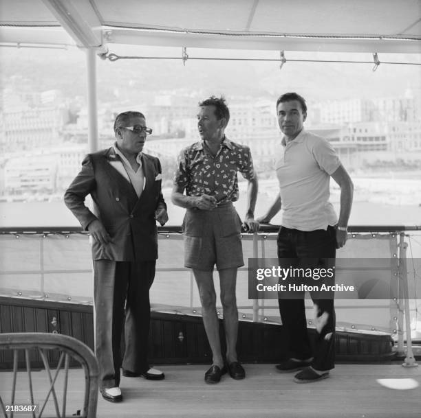 Greek shipping tycoon Aristotle Onassis with Porfirio Rubirosa and friend on board the family's luxury yacht 'Christina' in Monte Carlo in 1958.