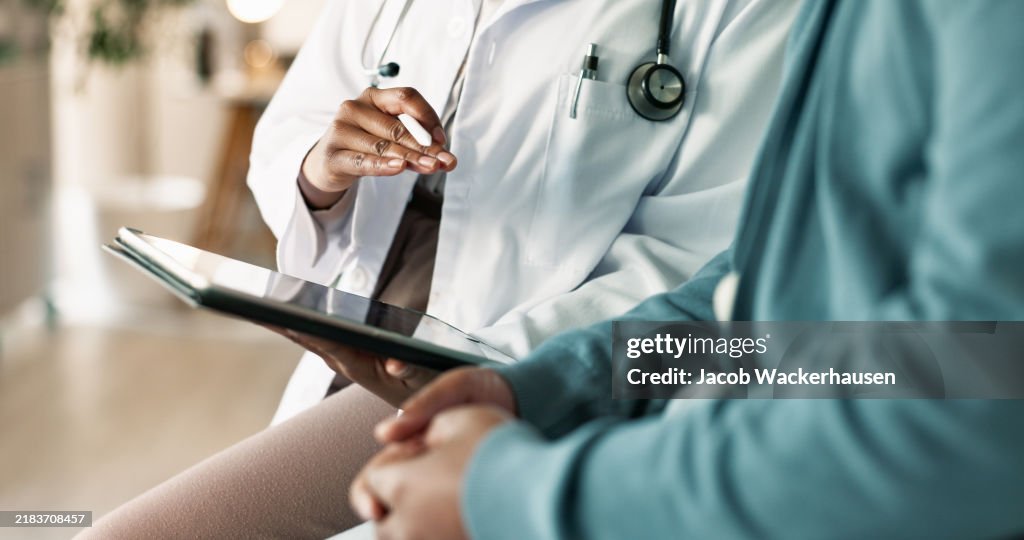 Tablet, hands and patient with doctor in hospital for consultation with cold, flu and sickness. Digital technology, conversation and person with healthcare worker for medical diagnosis in clinic.