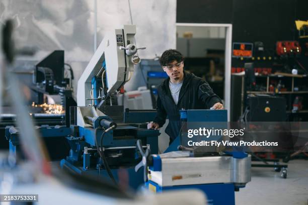 engineer operating metal engraver in factory - metallic stock pictures, royalty-free photos & images