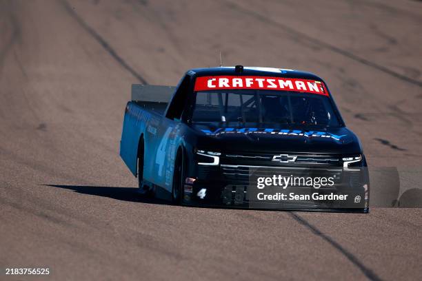 Brett Moffitt, driver of the Victory Custom Trailers Chevrolet, drives during qualifying for the NASCAR Craftsman Truck Series Championship Race at...