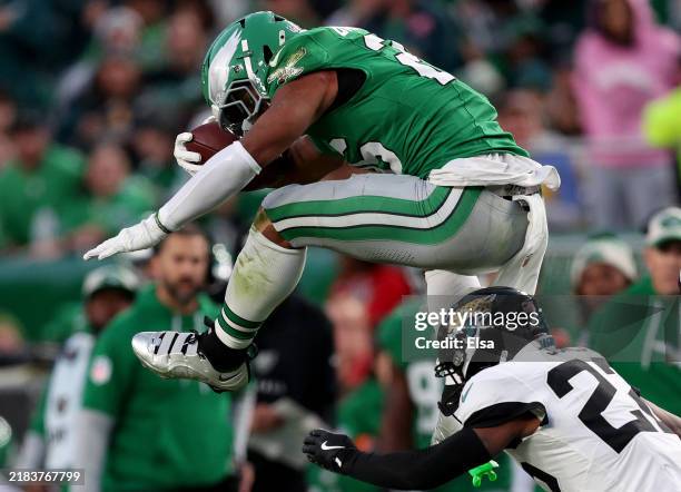 Saquon Barkley of the Philadelphia Eagles reverse hurdles over Jarrian Jones of the Jacksonville Jaguars in the second quarter at Lincoln Financial...