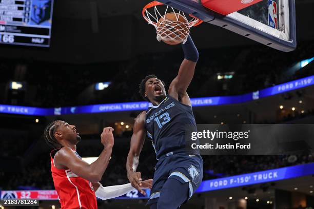 Jaren Jackson Jr. #13 of the Memphis Grizzlies goes to the basket against Alexandre Sarr of the Washington Wizards during the first half at...