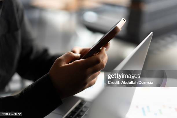 close-up of young woman hand using smartphone - hand holding phone stock pictures, royalty-free photos & images