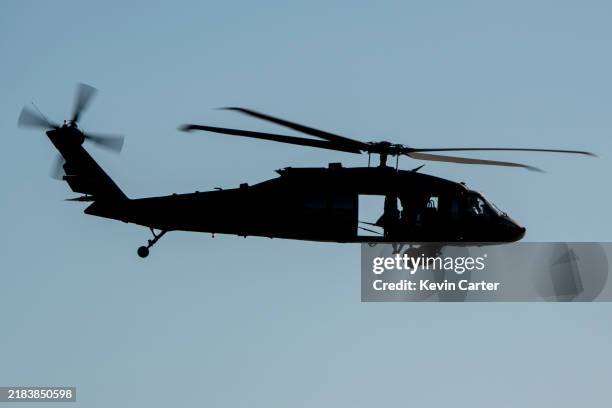 Army Sikorsky UH-60 Black Hawk helicopter flies along the coast on November 8 in Laguna Beach, California.