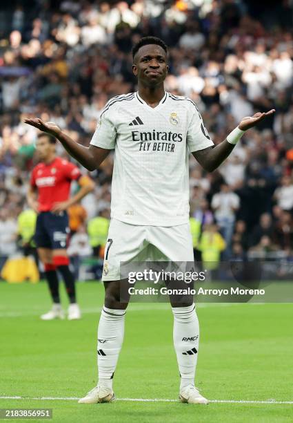 Vinicius Junior of Real Madrid celebrates scoring his team's fourth goal and completing his hat trick during the LaLiga match between Real Madrid CF...