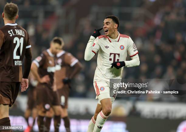 Jamal Musiala of FC Bayern Muenchen celebrates after scoring his team`s first goal during the Bundesliga match between FC St. Pauli 1910 and FC...
