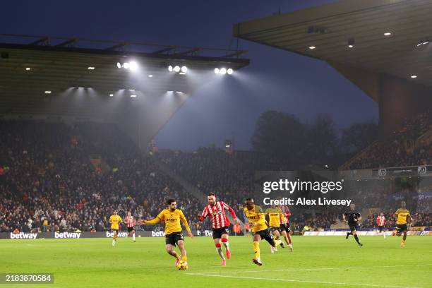 General view of Ben Brereton Diaz of Southampton is challenged by Rayan Ait-Nouri and Toti Gomes of Wolverhampton Wanderers during the Premier League...