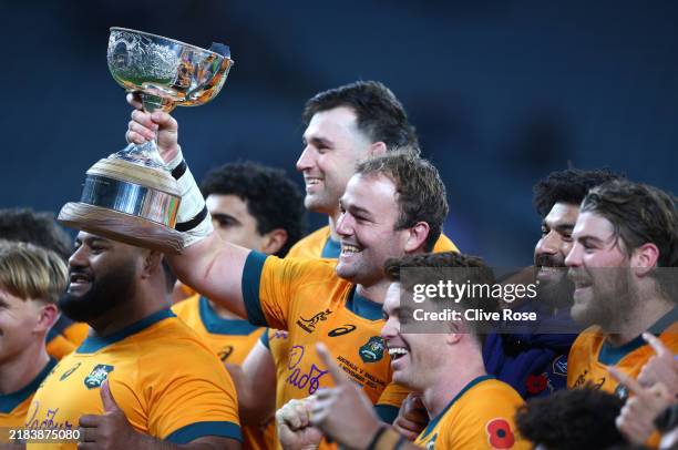 Harry Wilson of Australia celebrates with the Ella-Mobbs Trophy following the team's victory during the Autumn Nations Series 2025 match between...