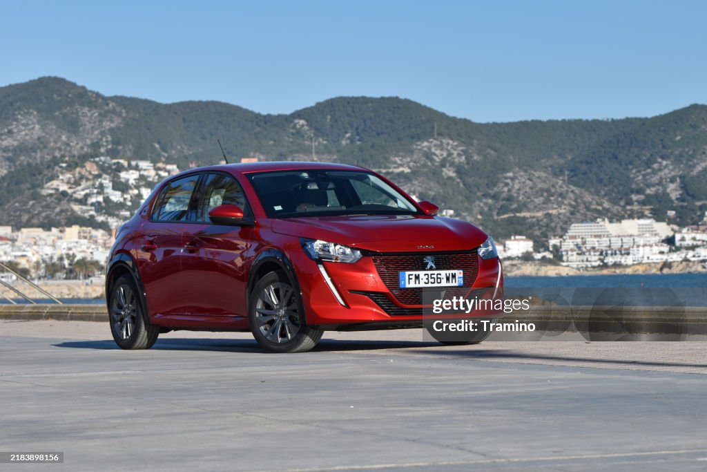 Electric city car Peugeot on a street