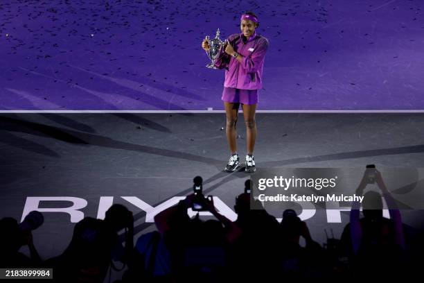 Coco Gauff of the United States celebrates with the Billie Jean King trophy after her win against Qinwen Zheng of China in their Women's Singles...