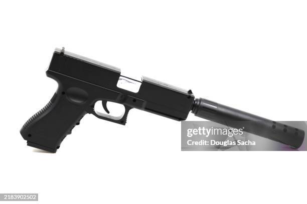 handgun on a white background with silencer / suppressor - revolver-with-silencer stock-fotos und bilder