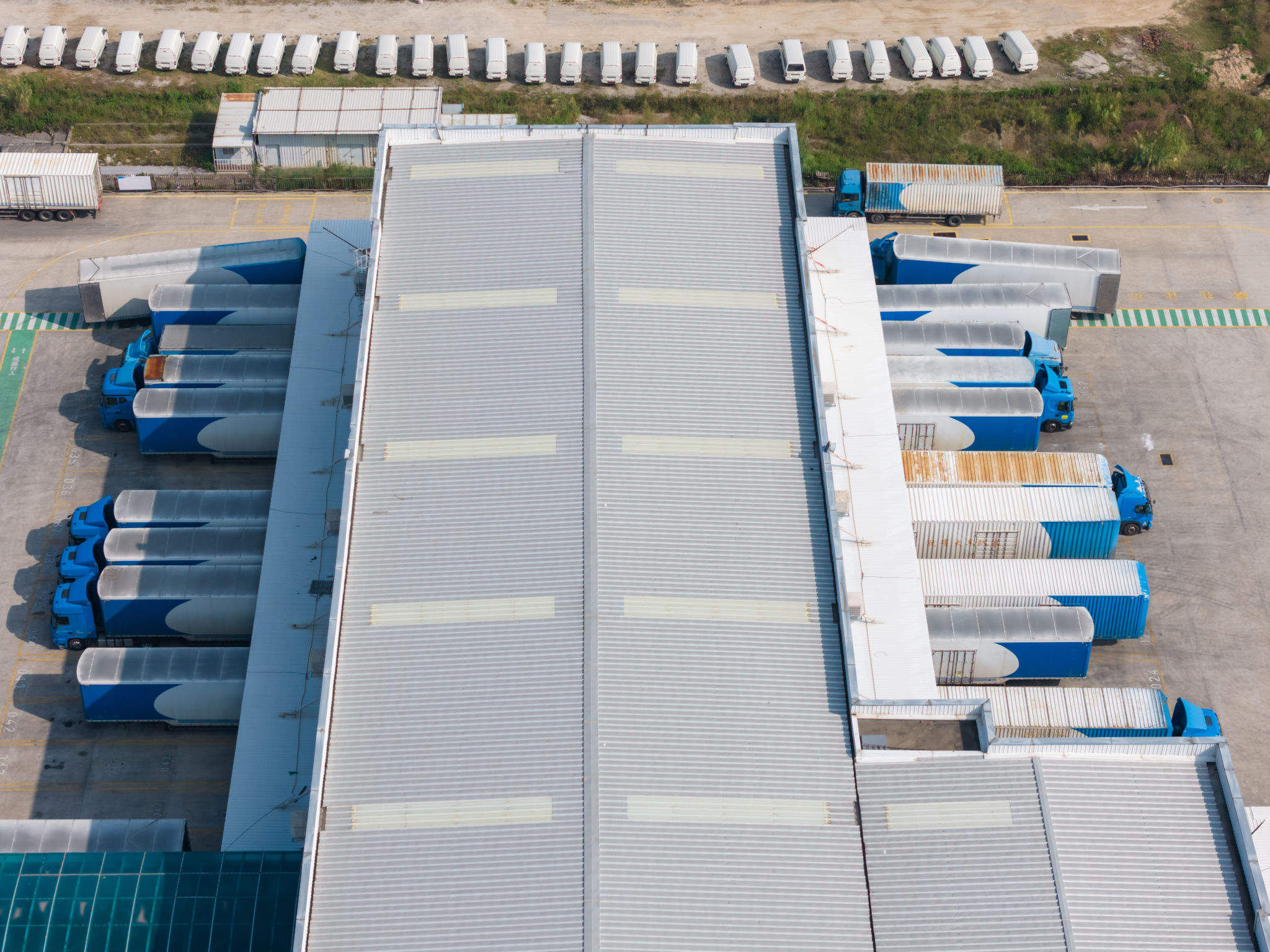 High angle shot of logistics park and large trucks High angle shot of logistics park and large trucks