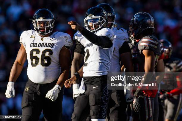 Shedeur Sanders of the Colorado Buffaloes signals for a first down during the first half of the game against the Texas Tech Red Raiders at Jones AT&T...