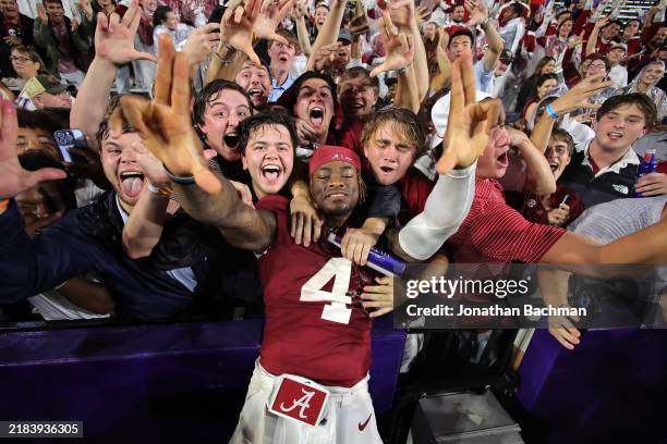 Jalen Milroe of the Alabama Crimson Tide celebrates the win with fans after a game against the LSU Tigers at Tiger Stadium on November 09, 2024 in...