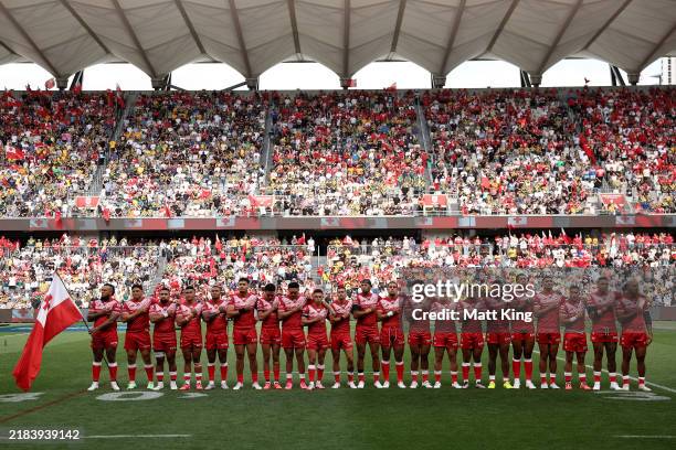 Tonga line up during the national anthem before the 2024 Pacific Championships Pacific Cup Men's Final match Australia Kangaroos and Tonga XIII at...