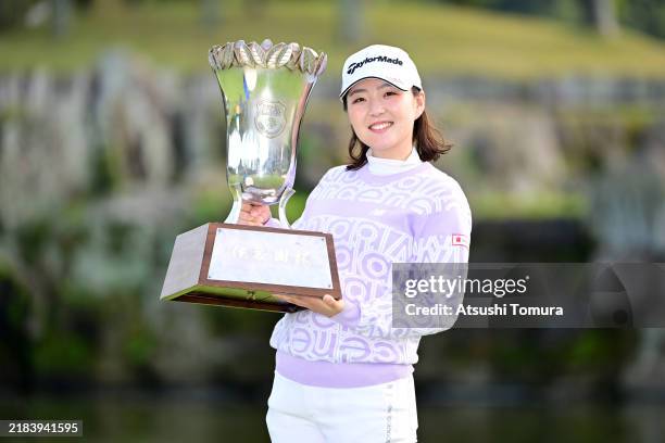 Hinaco Yamauchi of Japan poses with the trophy after winning the tournament following the final round of 40th Itoen Ladies Golf Tournament at Great...