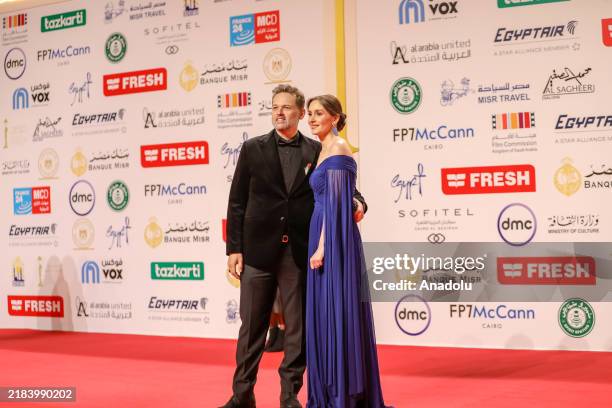 Egyptian actor Mohamed Mahmoud Abdel Aziz poses to photographers on the red carpet as he attends the 45th Cairo International Film Festival at Cairo...