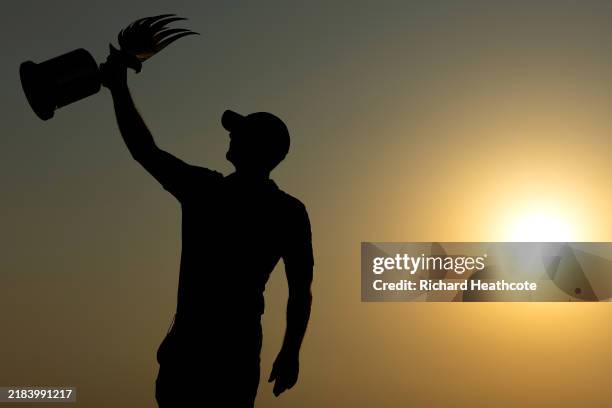 Paul Waring of England poses with the trophy on the 18th green on day four of the Abu Dhabi HSBC Championship 2024 at Yas Links Golf Course on...