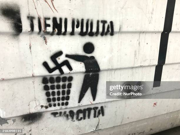 Message on an unsorted waste bin in Bari, Italy, on October 4 displays an anti-Nazi symbol with the phrase ''Keep the city clean.'' The image...
