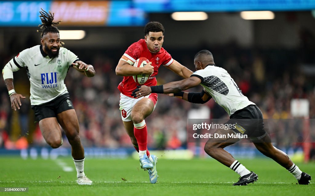 Ellis Bevan of Wales is challenged by Jiuta Wainiqolo of Fiji during Ellis Bevan of Wales is challenged by Jiuta Wainiqolo of Fiji during