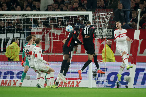 Hugo Ekitike of Eintracht Frankfurt scores his team's first goal past Alexander Nuebel of VfB Stuttgart during the Bundesliga match between VfB...