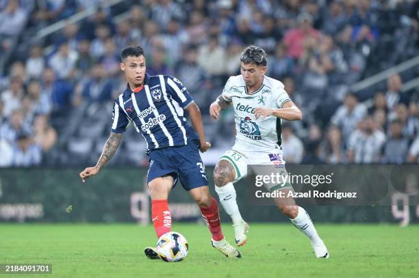 Roberto De la Rosa of Monterrey passes the ball next to Jordy Alcivar of León during the 17th round match between Monterrey and Leon as part of the...
