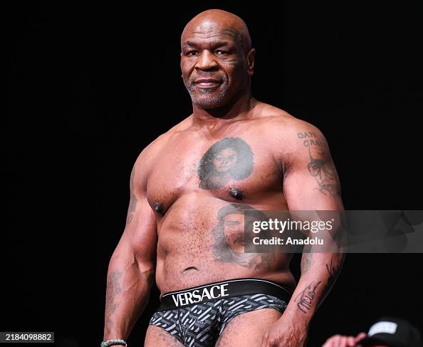 Tyson Ratering Mike Tyson gets on scale during Weigh-In at the Toyota Music Factory ...